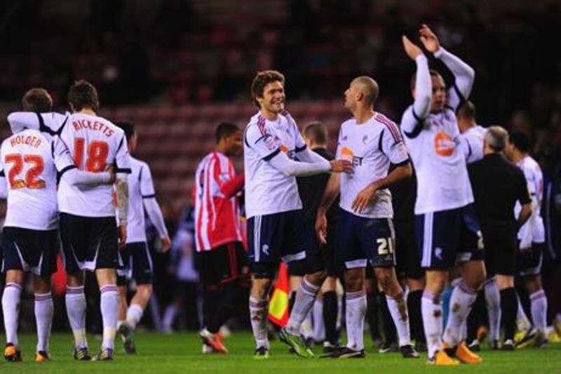 Bolton players celebrate after their FA Cup third round replay win over Sunderland.