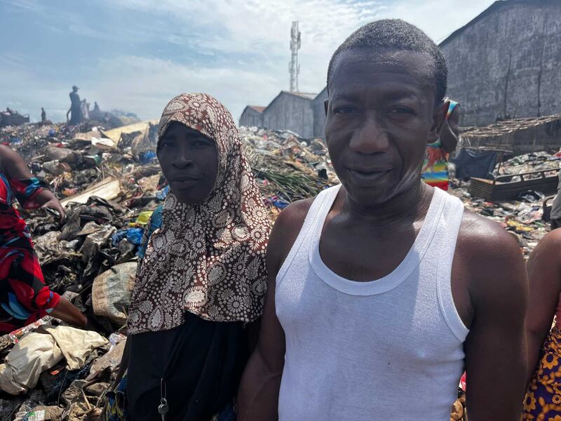 Kaditu Kariwallie, 55, a grandmother who raised her children and grandchildren on the site and Maligie Koroma, Freetown City Council supervisor at the Bomeh refuse site in Freetown Sierra Leone. Nick Webster / The National
