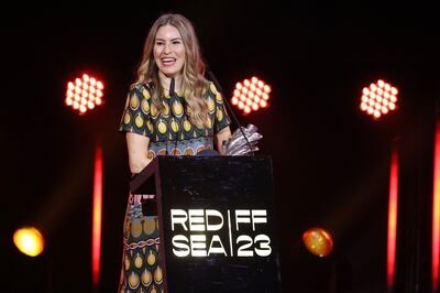 Farah Nabulsi accepts Best Actor Award on behalf of Saleh Bakri for The Teacher at the Red Sea International Film Festival. Getty Images