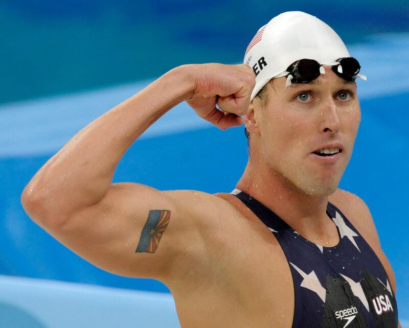 FILE - In this  Tuesday, Aug. 12, 2008 file photo, United States' relay swimmer Klete Keller reacts after a men's 4x200-meter freestyle relay heat during the swimming competitions in the National Aquatics Center at the Beijing 2008 Olympics in Beijing. Five-time Olympic swimming medalist Klete Keller was charged Wednesday, Jan. 13, 2021  with participating in a deadly riot at the U.S. Capitol after video emerged that appeared to show him among those storming the building last week. (AP Photo/Thomas Kienzle, File)