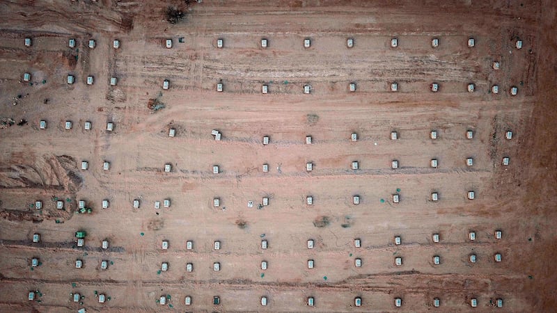 An aerial picture taken with a drone shows graves of coronavirus victims at a cemetary in the holy city of Najaf, Iraq.  EPA