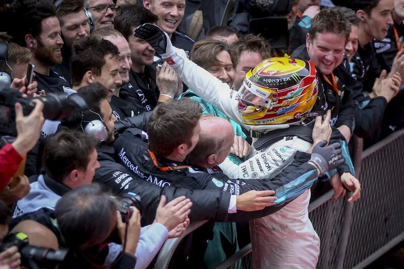 Lewis Hamilton celebrates with Mercedes-GP team members after his victory in the Chinese Grand Prix. Diego Azubel / EPA 
