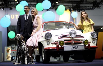 epa07496240 Models pose with a 1956 Skoda Spartak 440 at the 'Techno Classica' fair for classic and vintage cars in Essen, Germany, 10 April 2019. The world fair for classic and vintage cars takes place from 10 April to 14 April 2019.  EPA/FRIEDEMANN VOGEL