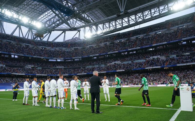 Real Madrid players give Real Betis a guard of honour before the game. Getty
