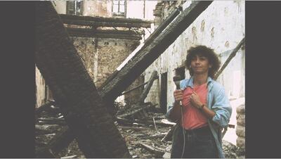 Jocelyne Saab films in front of her burnt home in Beirut after Israel’s invasion