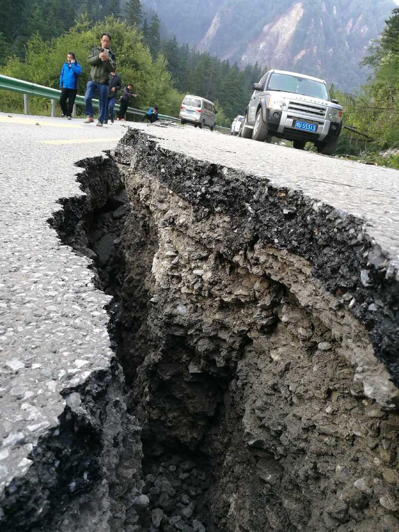 A crack, caused by an earthquake, is seen on a road in Jiuzhaigou in China's southwestern Sichuan province.  AFP