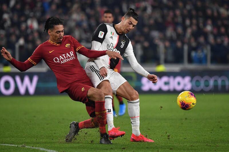 Chris Smalling and Cristiano Ronaldo. AFP