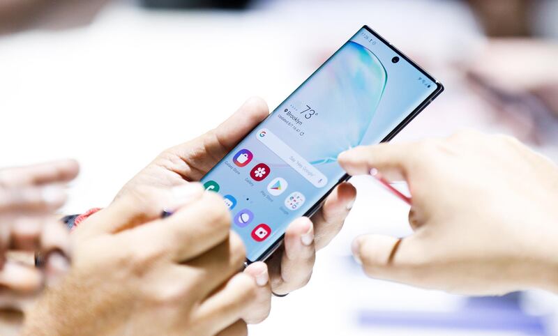 People try out the new Samsung Note 10 plus phone. EPA