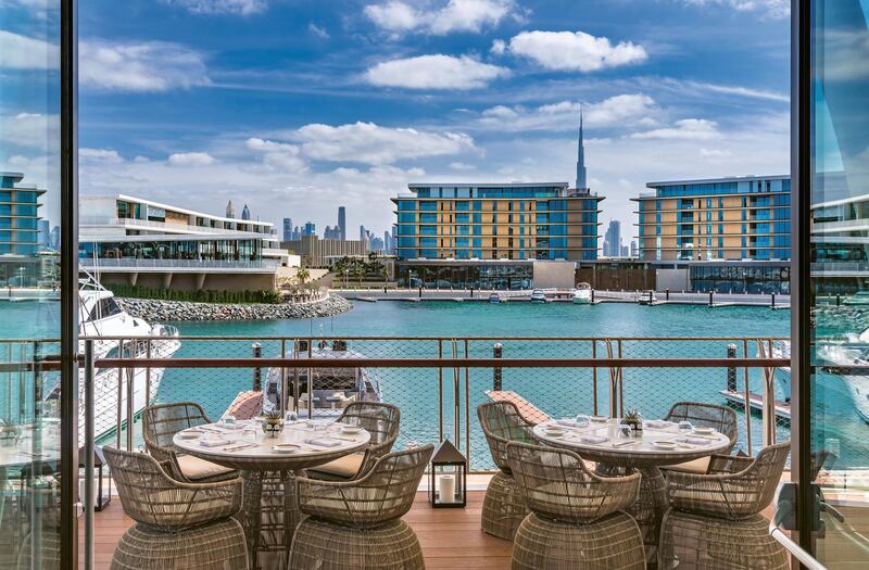 The Yacht Club has an outdoor terrace and a comfortable indoor space. Bulgari Resort Dubai 