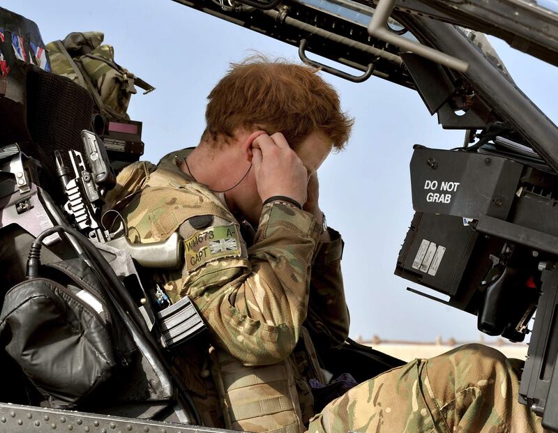 Britain's Prince Harry sits in his cockpit as he prepares for a mission, at the British controlled flight-line in Camp Bastion, southern Afghanistan in this photograph taken October 31, 2012, and released January 22, 2013. The Prince, who is serving as a pilot/gunner with 662 Squadron Army Air Corps, is on a posting to Afghanistan that runs from September 2012  to January 2013.  Photograph taken October 31, 2012.     REUTERS/John Stillwell/Pool  (AFGHANISTAN - Tags: MILITARY POLITICS SOCIETY ROYALS CONFLICT) *** Local Caption ***  LON007_BRITAIN-HARR_0122_11.JPG