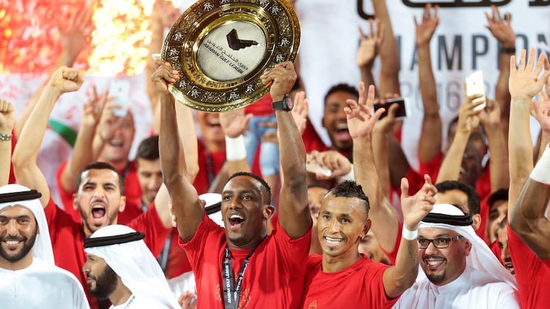 Al Ahli players, seen here lifting the Arabian Gulf League trophy in 2016, a year before they merged with Al Shabab and Dubai to form Shabab Al Ahli Dubai Club. Christopher Pike / The National