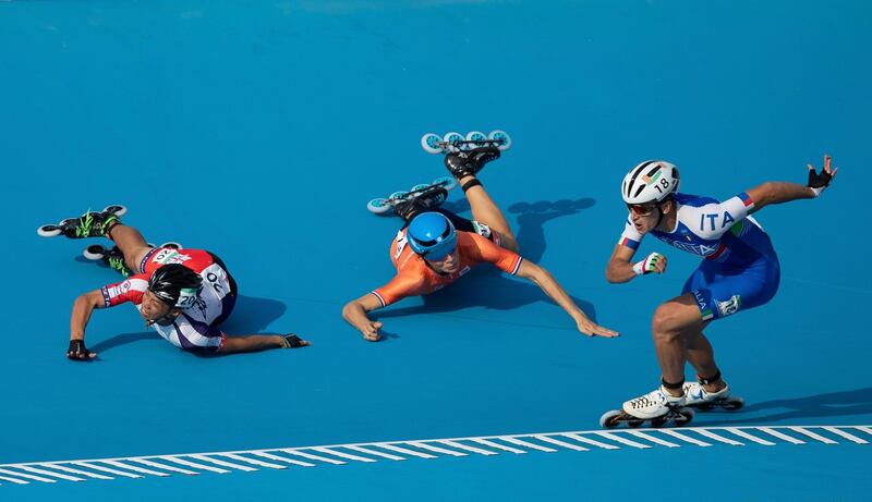 Italy's Vincenzo Maiorca takes the lead as his competitors fall during the Roller Speed Skating final at the Youth Olympic Games in Buenos Aires, Argentina. Simon Bruty/AP Photo