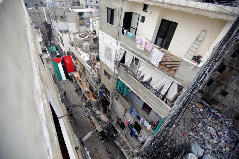 A picture taken on December 21, 2017 shows a Palestinian flag hanging next to a makeshift Turkish flag from buildings across a street in the Burj al-Barajneh camp, a southern suburb of the Lebanese capital Beirut. - More than 174,000 Palestinian refugees live in Lebanon, authorities announced on December 21, in the first-ever census of its kind for a country where demographics have long been a sensitive subject.
The census was carried out by the government's Lebanese-Palestinian Dialogue Committee in 12 Palestinian camps as well as 156 informal "gatherings" across the country. (Photo by ANWAR AMRO / AFP)