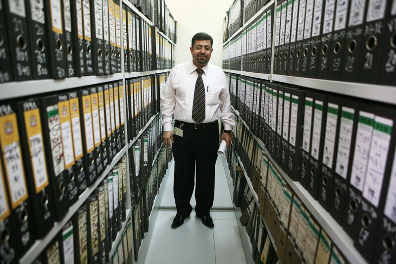 United Arab Emirates - Abu Dhabi - March 1st, 2009:  Dr Adnan Said Abbas a foresnic pathologist at Khalifa Medical City's morgue stands among an archive of death certificates.  (Galen Clarke/The National) For story by Marten Youssef *** Local Caption ***  GC07_03012009_Morgue.jpg