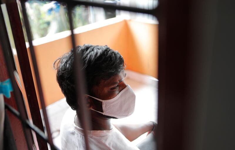 Sri Lankan auto rickshaw driver Prasad Dinesh, linked by Sri Lankan officials to nearly half the country's more than 2,600 coronavirus cases, sits in his house in Ja-Ela, Sri Lanka, Wednesday, July 1, 2020. For months heâ€™s been anonymous, but now Dinesh is trying to clear his name and shed some of the stigma of a heroin addiction at the root of his ordeal. Referring to him only as â€œPatient 206,â€ government officials lambasted Dinesh on TV and social media, blaming him for at least three clusters of cases, including about 900 navy sailors who were infected after an operation in Ja-Ela, a small town about 19 kilometers (12 miles) north of the capital, Colombo. Dinesh, however, says his drug addiction, which is considered a crime in Sri Lanka, makes him a convenient scapegoat. (AP Photo/Eranga Jayawardena)