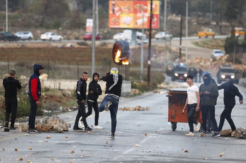 Palestinian protesters at the northern entrance to the city of Ramallah, in the occupied West Bank. AFP