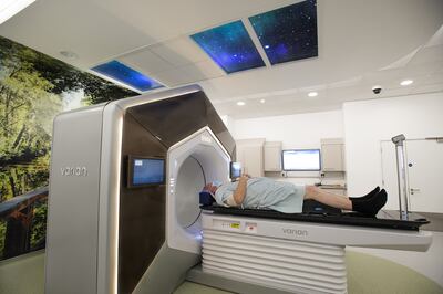 A patient in the UK undergoes a treatment called Ethos in which a machine which uses artificial intelligence to deliver a prescription dose to tumours. PA