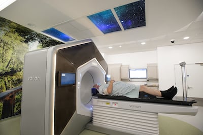 A patient undergoing a treatment called Ethos, involving a machine that uses artificial intelligence to deliver a prescription dose to tumours. Photo: NHS