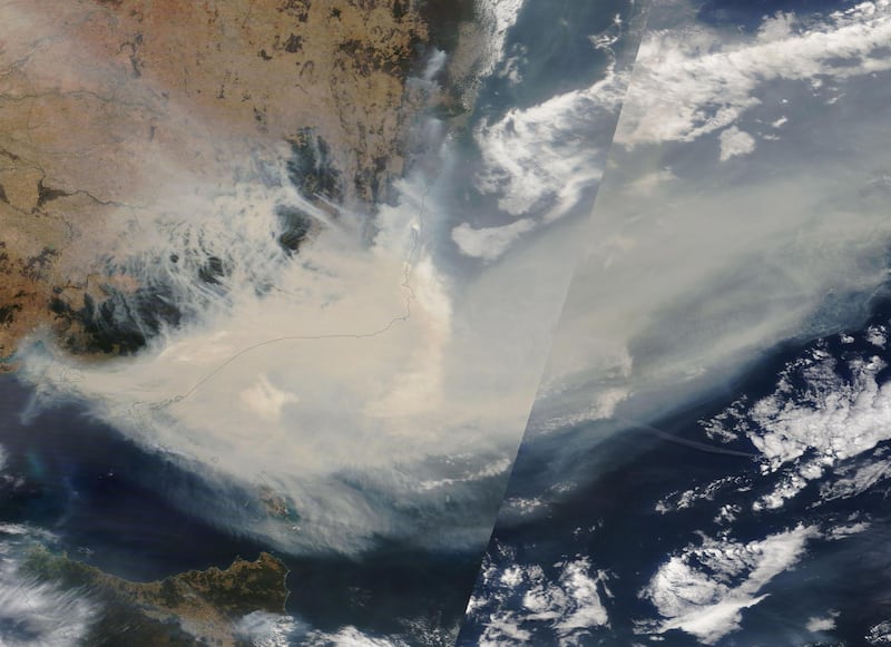 A handout satellite image made available by NASA shows thick smoke moving into the Tasman Sea from the states of New South Wales and Victoria.  EPA