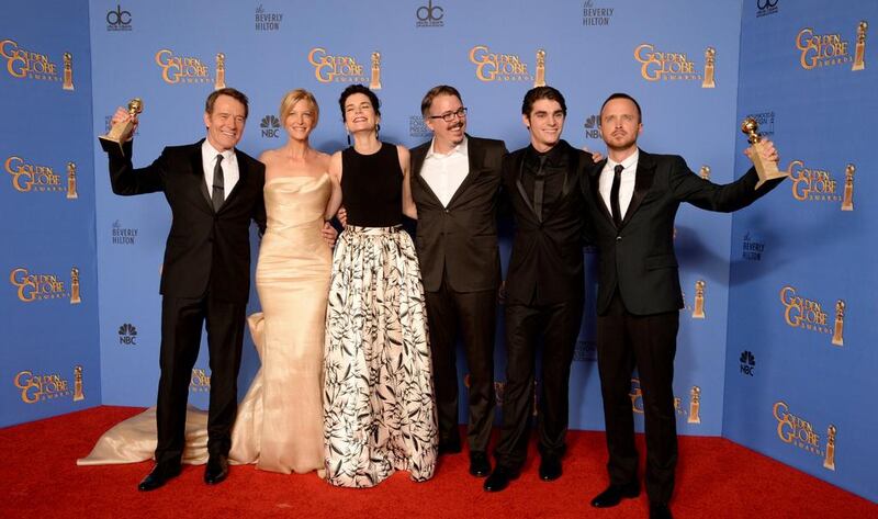 Actors Bryan Cranston, Anna Gunn and Betsy Brandt, writer-producer Vince Gilligan, actors R.J. Mitte and Aaron Paul celebrate winning Best Series - Drama for Breaking Bad. AFP  