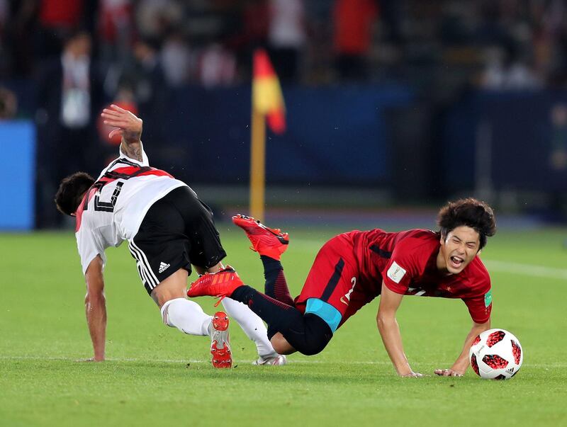 Abu Dhabi, United Arab Emirates - December 22, 2018: River Plate's Milton Casco and Antlers Atsuto Suntae during the match between River Plate and Kashima Antlers at the Fifa Club World Cup 3rd/4th place playoff. Saturday the 22nd of December 2018 at the Zayed Sports City Stadium, Abu Dhabi. Chris Whiteoak / The National