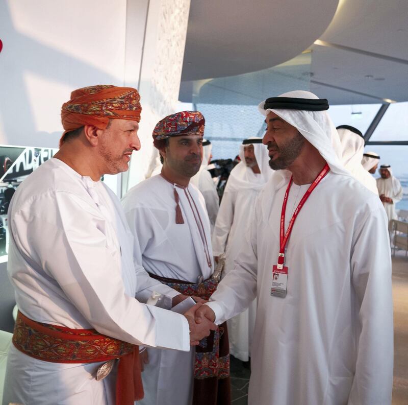 YAS ISLAND, ABU DHABI, UNITED ARAB EMIRATES - December 01, 2019: HH Sheikh Mohamed bin Zayed Al Nahyan, Crown Prince of Abu Dhabi and Deputy Supreme Commander of the UAE Armed Forces (R), greets a guest at Shams Tower during the Formula 1 2019 Etihad Airways Abu Dhabi Grand Prix at Yas Marina Circuit. 

( Hamad Al Kaabi  / Ministry of Presidential Affairs )
---