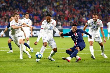 Neymar finds room under pressure to score Paris Saint-Germain's late winner against Lyon earlier in the season. Reuters