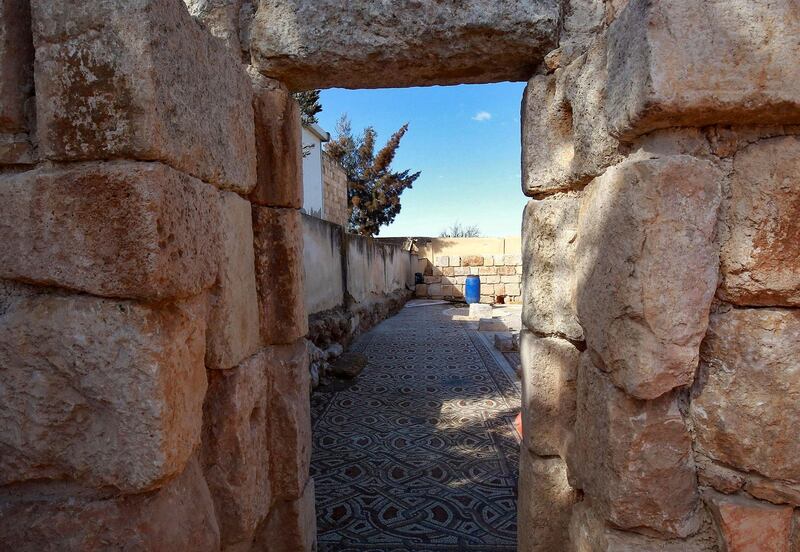 The mosaic flooring of the Church of St Mary, built in the year 543, framed by an ancient doorway. AFP