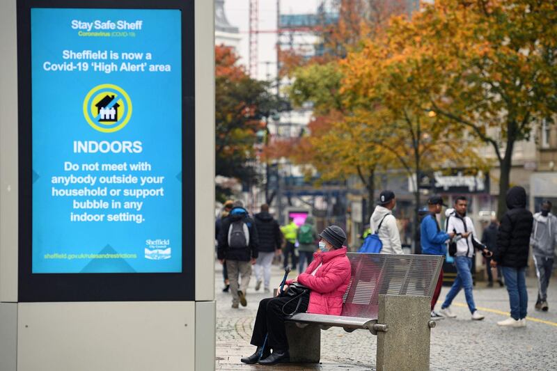 A display showing health advice in central Sheffield. More than a million people in northern England will be banned from mixing with other households under tougher new coronavirus rules. AFP