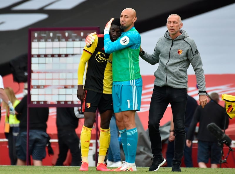 Watford goalkeeper Heurelho Gomes consoles Ismaila Sarr after the club's relegation from the Premier League. EPA