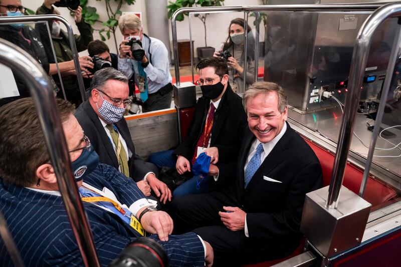 Defense attorney Michael van der Veen (R), along with other members of Trump's defense team, get on the Senate subway after the conclusion of the second impeachment trial of former US President Donald J. Trump in Washington, DC. The US Senate voted to acquit former US president Trump in his impeachment trial held on the charge of incitement of insurrection for his role in 06 January violent attack on the US Capitol.  EPA