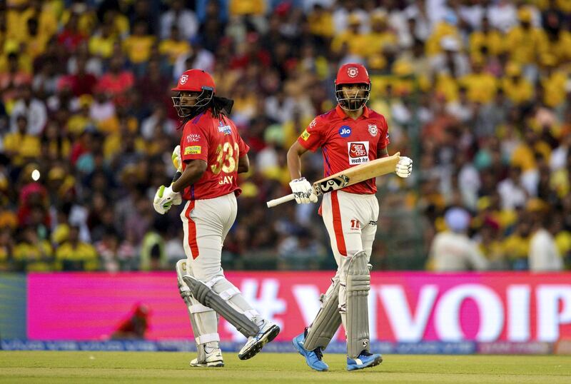 Kings XI Punjab cricketer Chris Gayle (L) and KL Rahul run between the wickets during the 2019 Indian Premier League (IPL) Twenty20 cricket match between Kings XI Punjab and Chennai Super Kings at the Punjab Cricket Association Stadium in Mohali on May 5, 2019. (Photo by Sajjad HUSSAIN / AFP) / ----IMAGE RESTRICTED TO EDITORIAL USE - STRICTLY NO COMMERCIAL USE-----