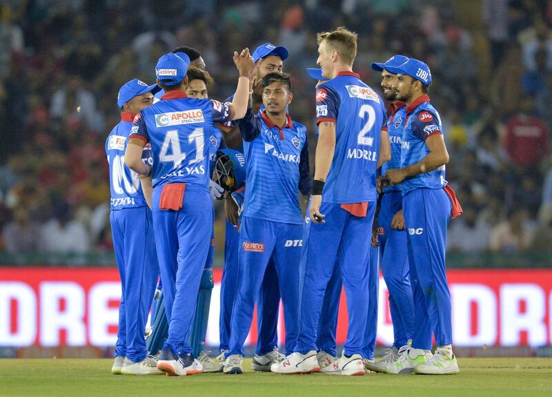Delhi Capitals bowler Sandeep Lamichhane (C) celebrates with his teammates after he dismissed Kings XI Punjab cricketer Sam Curran during the 2019 Indian Premier League (IPL) Twenty20 cricket match between Kings XI Punjab and Delhi Capitals at the Punjab Cricket Association Stadium in Mohali on April 1, 2019. (Photo by Sajjad HUSSAIN / AFP) / ----IMAGE RESTRICTED TO EDITORIAL USE - STRICTLY NO COMMERCIAL USE-----
