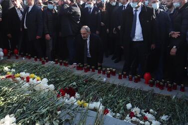 Armenian Prime Minister Nikol Pashinyan (centre) during his visit to the Yerablur military pantheon, the burial place of Armenian soldiers who were killed during the Nagorno-Karabakh conflict, in the outskirts of Yerevan, Armenia. EPA