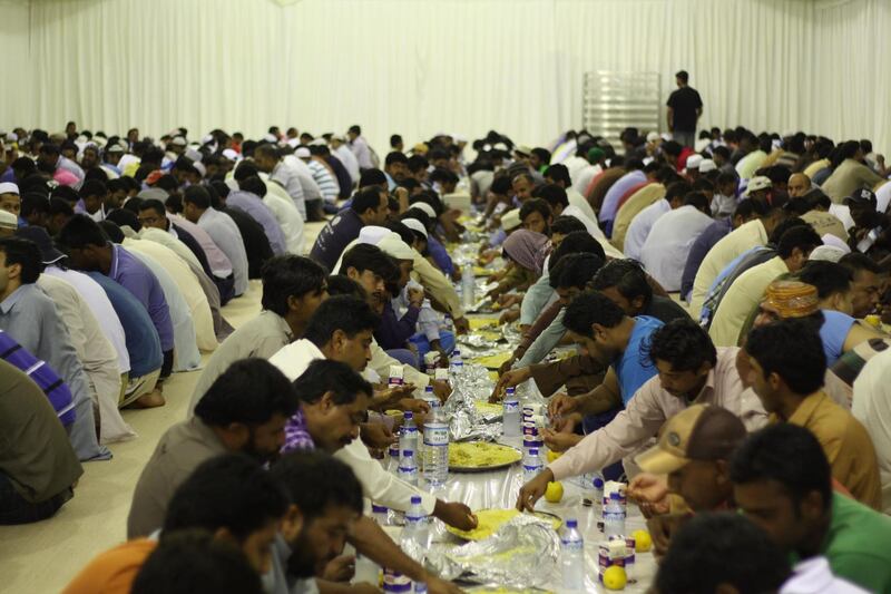 DUBAI, UNITED ARAB EMIRATES - JUNE 29:  Muslims gather in iftar tents pitched by Dubai government to break their fast on the first day of holy mont Ramadan in Dubai, United Arab Emirates, on June 29,2014. (Photo by Ahmet Esad Sani/Anadolu Agency/Getty Images)