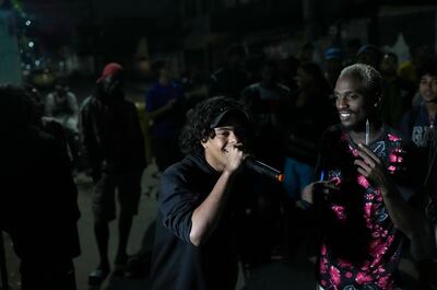 Rappers perform inside the City of God favela of Rio de Janeiro, Brazil. AP Photo / Silvia Izquierdo
