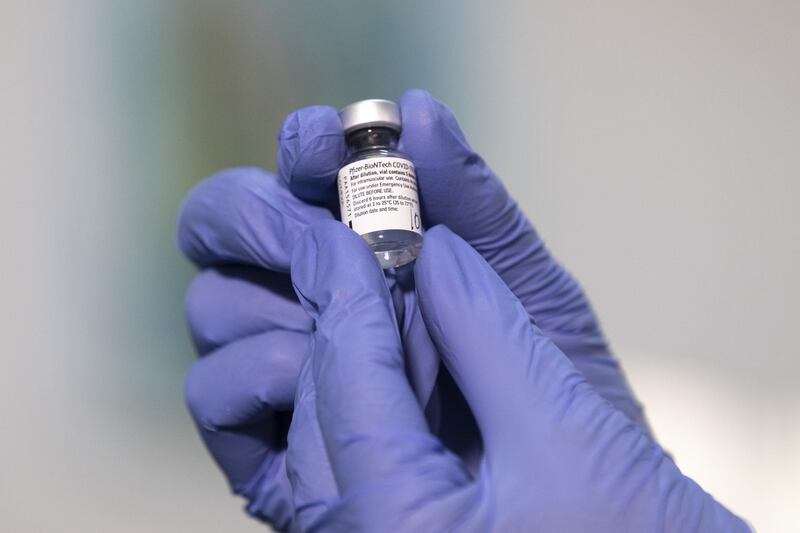 A nurse handles a vial of the Pfizer-BioNTech Covid-19 vaccine, during the vaccination campaign at AHEPA Hospital in Thessaloniki, Greece on Tuesday, Dec. 29, 2020. After inoculations in Europe started with fanfare last weekend, authorities are now grappling with ways to ensure widespread uptake without sowing further discontent among the pandemic-weary public. Photographer: Konstantinos Tsakalidis/Bloomberg