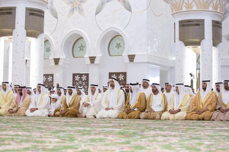 Sheikh Mohammed bin Zayed attends Eid Al Fitr prayers at Sheikh Zayed Grand Mosque. Seen with Sheikh Mohammed bin Butti Al Hamed, second right, Sheikh Nahyan bin Mubarak, Minister of Culture Youth and Community Development, third right, Sheikh Suroor bin Mohammed, fourth right, Sheikh Saif bin Mohammed, fifth right, Sheikh Hazza bin Zayed, seventh right, Sheikh Nahyan bin Zayed, eighth right, Sheikh Zayed bin Nahyan, ninth right, Sheikh Saif bin Zayed, UAE Deputy Prime Minister and Minister of Interior, tenth right, Sheikh Tahnoon bin Zayed, Deputy National Security Advisor and Chairman of the Presidential Aviation Authority, second left, and  Sheikh Mansour bin Zayed, Deputy Prime Minister and Minister of Presidential Affairs, left. Ryan Carter / Crown Prince Court - Abu Dhabi