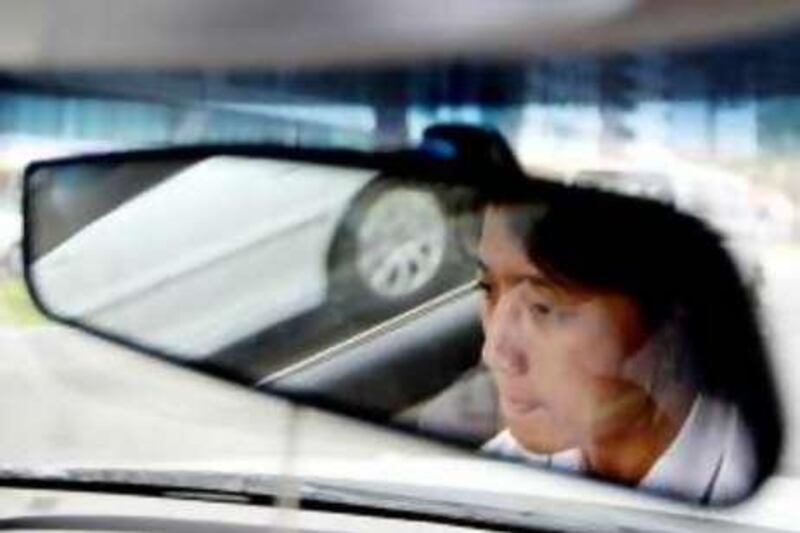 Abu Dhabi - July 22- 2008 - Al Ghazal Taxi driver Arlene Tan at the wheel of her taxi in Abu Dhabi July 22, 2008.  (Andre Forget / The National) *** Local Caption ***  AF002-femaletaxi.jpg