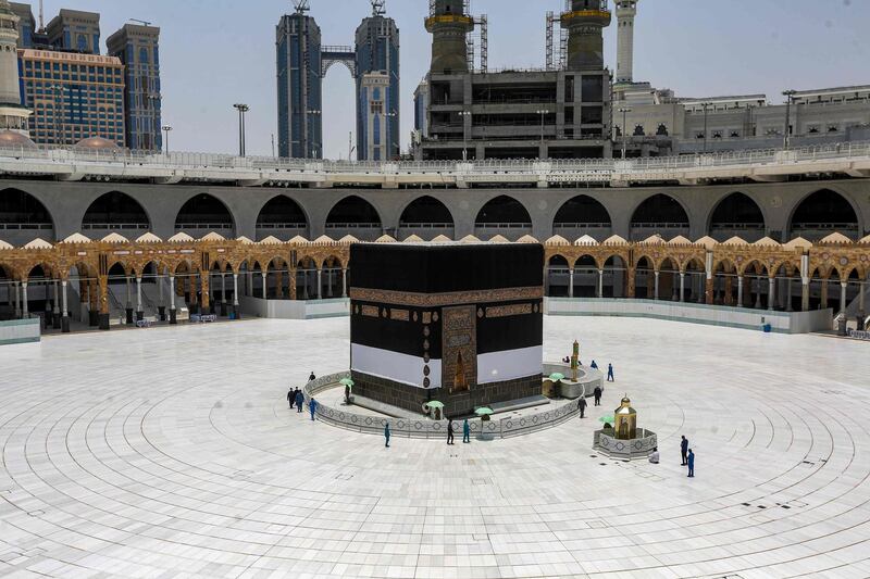 Workers at the Grand Mosque complex in Makkah work around the Kaaba before last year's Hajj pilgrimage.