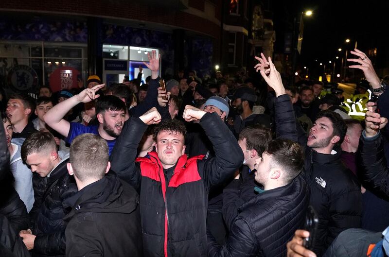 Chelsea fans celebrate outside their Stamford Bridge ground after beating Real Madrid 2-0 in their semi-final second leg and make the Champions League final where they will take on Manchester City. PA