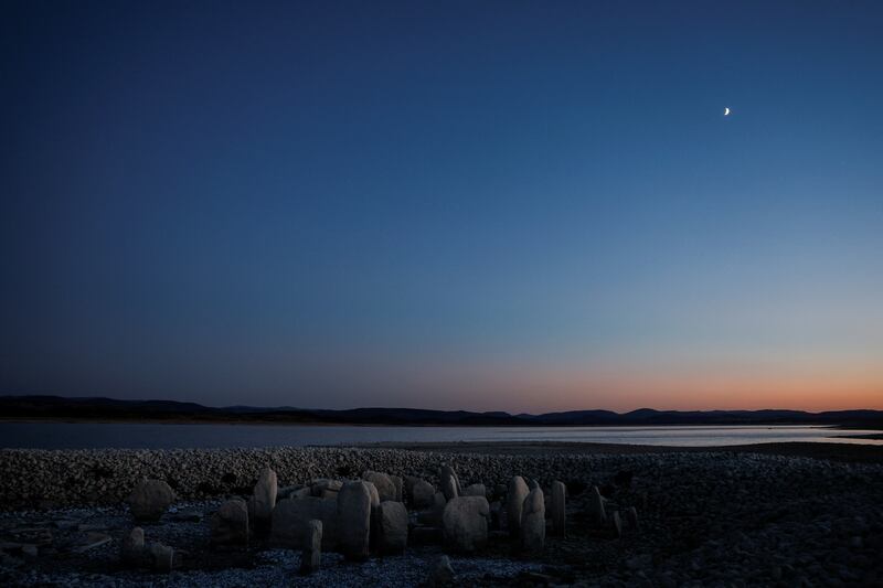 The dolmen of Guadalperal, also known as the Spanish Stonehenge, is seen due to the receding water of the Valdecanas reservoir near El Gordo, Spain. Reuters