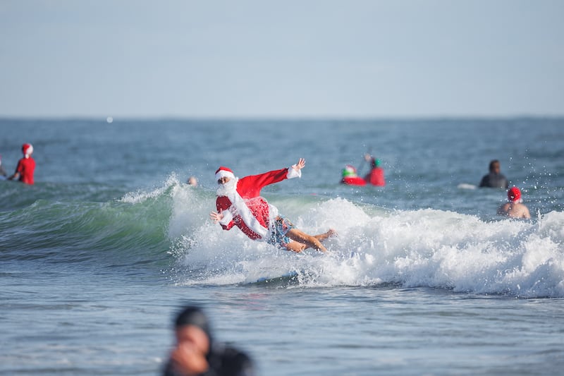Florida's Santa surf event began in 2009. Reuters