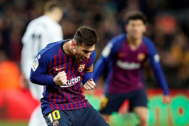 Lionel Messi celebrates his equaliser for Barcelona against Valencia. EPA