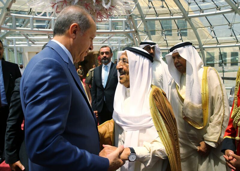 Turkey's President Recep Tayyip Erdogan, left, talks with Emir of Kuwait Sheikh Sabah Al Ahmad Al Sabah during his departure ceremony in Kuwait City, Kuwait, Monday, July 24, 2017. Erdogan later flew to Qatar on the final leg of a Gulf two-day tour, which also took him to already took him to Saudi Arabia, aimed at forging a resolution to the diplomatic standoff gripping the Gulf nation and four fellow Arab countries (Presidency Press Service/Pool Photo via AP)