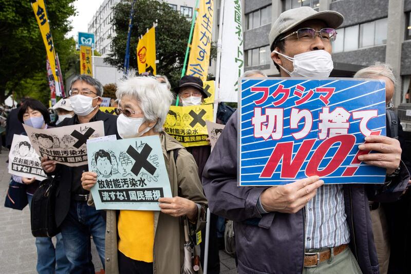 Demonstrators hold slogans during a protest against the Japanese government’s plan to release more than a million tonnes of treated water from the stricken Fukushima nuclear plant into the ocean, outside the prime minister’s office in Tokyo. AFP