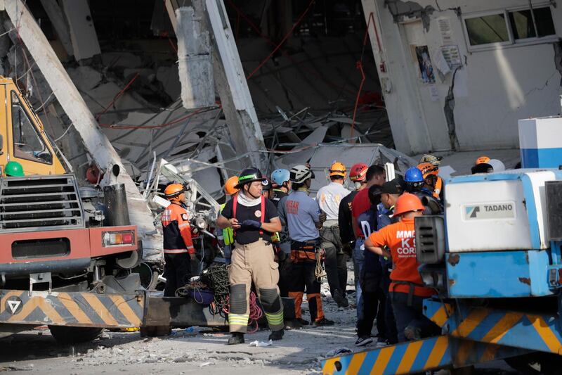 epa07522097 Search operations continue at a collapsed commercial building in Porac town, Pampanga Province, north of Manila, Philippines, 23 April 2019. A 6.1-magnitude earthquake occurred on 22 April in the Philippine region of Luzon with an epicenter located northeast of Zambales province, according to data from the Philippine Institute of Volcanology and Seismology (Phivolcs). According to latest data from the National Disaster Risk Reduction and Management Council (NDRRMC), at least seven people were killed, 81 were hurt and 24 are still missing.  EPA/FRANCIS R. MALASIG