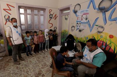 Syrian children are vaccinated at a health centre in the opposition-held city of Al Bab, on the border with Turkey, in Syria's northern Aleppo province, on September 25, 2022. The World Health Organisation warned on September 14 of a "very high" risk of cholera spreading throughout Syria. AFP