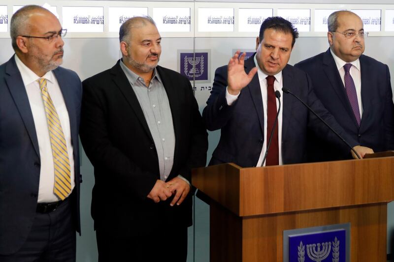 Members of the Joint List Ayman Odeh, center, speaks to the press in the presence of Ahmad Tibi, right, Osama Saadi, left, and Mansour Abbas, second left, following their consulting meeting with Israeli President Reuven Rivlin, in Jerusalem, Sunday, Sept. 22, 2019. Rivlin began two days of crucial talks Sunday with party leaders before selecting his candidate for prime minister, after a deadlocked repeat election was set to make forming any new government a daunting task. (Menahem Kahana/Pool via AP)