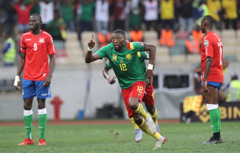 Karl Toko Ekambi, centre, of Cameroon celebrates after scoring against Gambia on Saturday. EPA